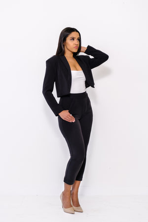 
                  
                    Modern cropped blazer with square shoulders and tailored sleeves
                  
                