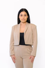 Modern cropped blazer with square shoulders and tailored sleeves