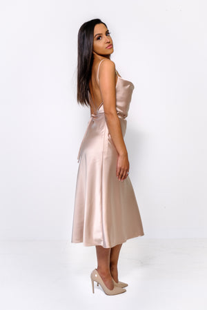 
                  
                    Midi dress with a low back and multi-way tie
                  
                