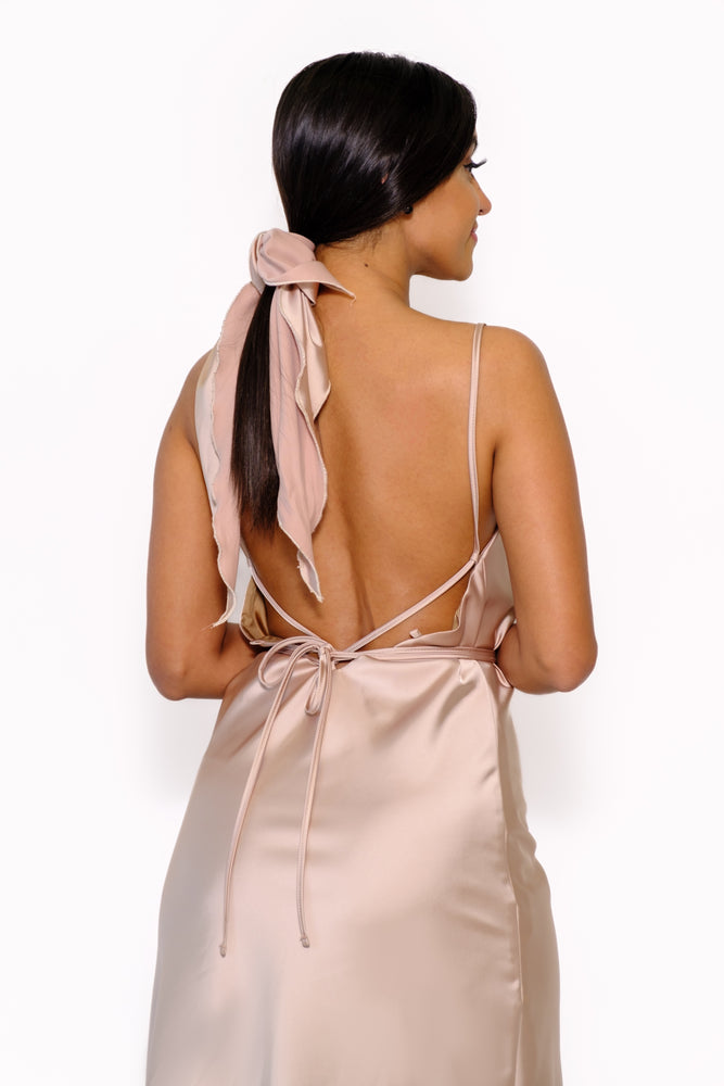 
                  
                    Scarf with a triangle cut for extremely versatile styling, from crop top to hair scarf to bag accessory.
                  
                